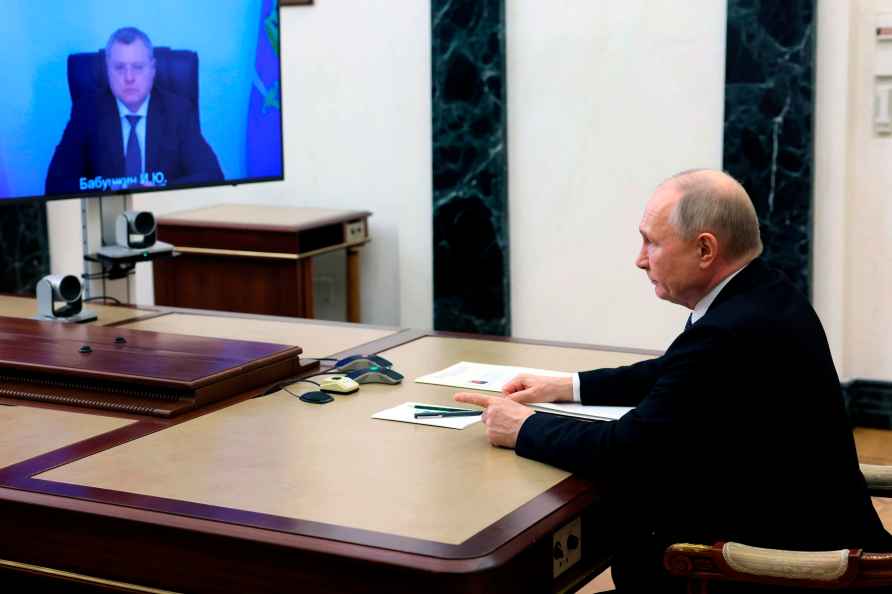 Russian President Vladimir Putin chairs a videoconference meeting...