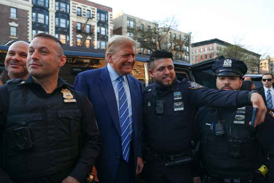 Former president Donald Trump, poses for a photo with New York Police...