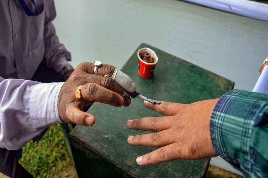 Dibrugarh: An election official marks the finger of a polling official...
